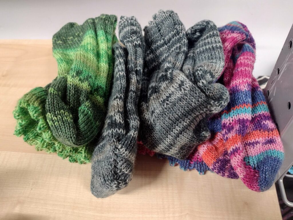 A pile of handmade wool socks